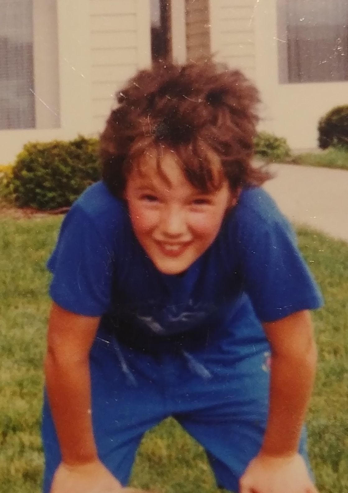 7 year old Miriam with her hands on her knees